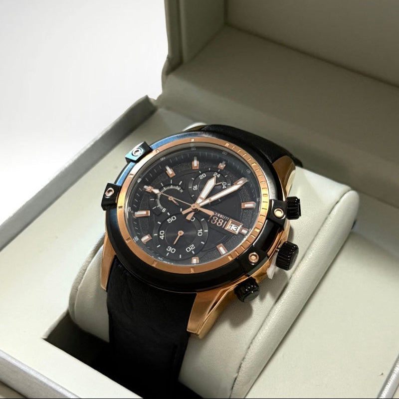 Luxury watch with black dial and rose gold accents in a Cerruti 1881 box.